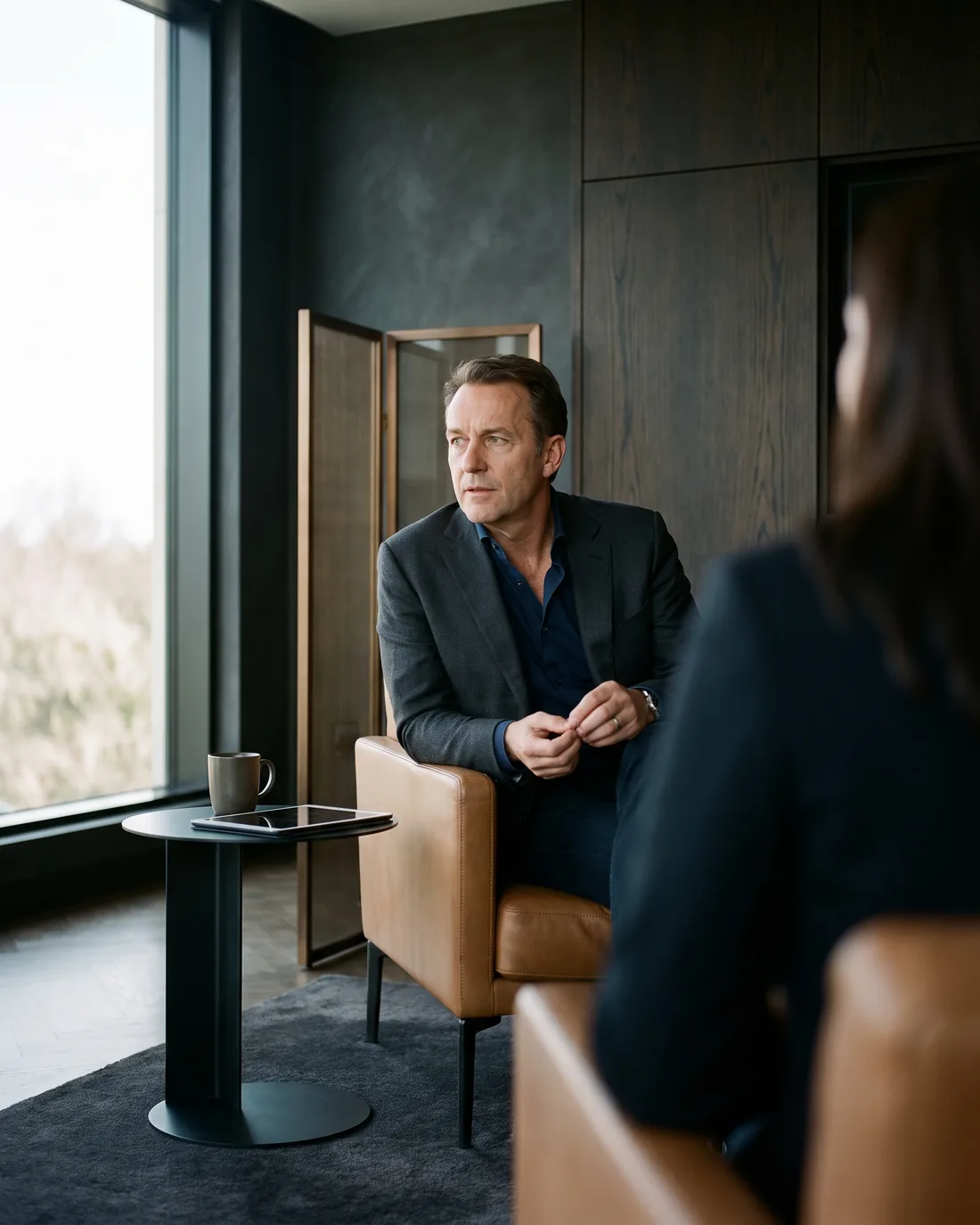 A senior CHRO reviewing the work in a calm Charlotte boardroom